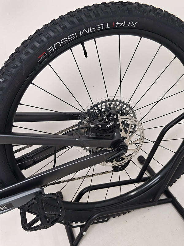 Trek Top Fuel 8 GX AXS 2024 displayed in a showroom setting, emphasizing its premium build quality.