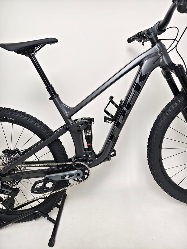 Trek Top Fuel 8 GX AXS 2024 highlighted bike specs in focus showing quality and performance features.