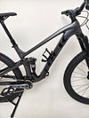 Trek Top Fuel 8 GX AXS 2024 bike in natural lighting to depict its pristine condition.