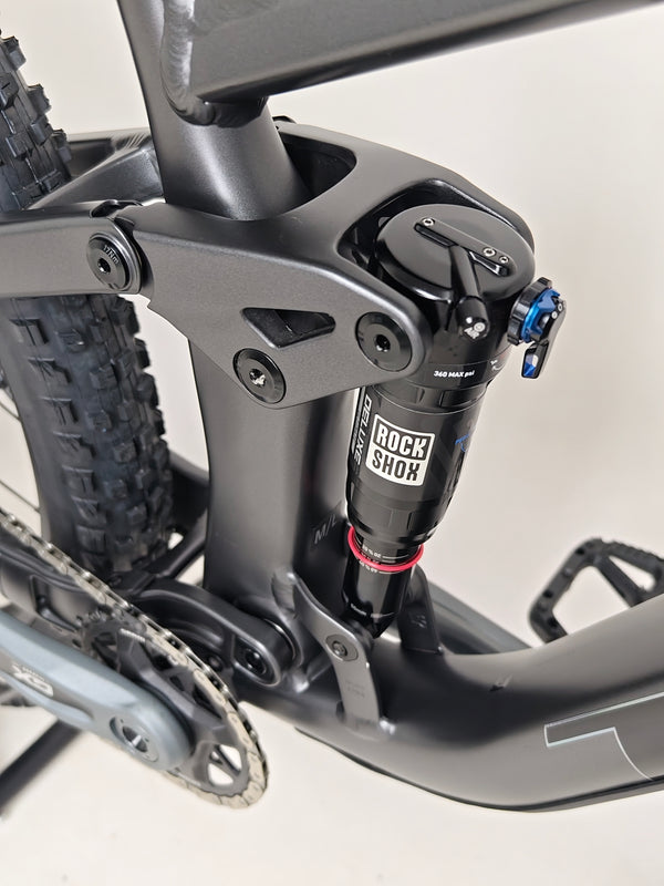 Trek Top Fuel 8 GX AXS 2024 bike in dynamic pose to showcase its suitability for mountain trails.