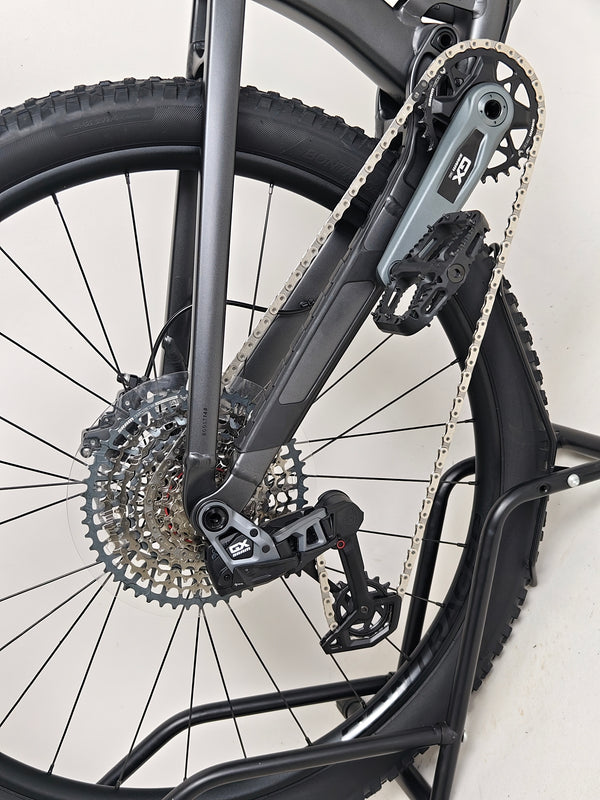 Trek Top Fuel 8 GX AXS 2024 captured from a side angle to showcase its advanced mountain bike features.