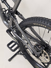 Action shot of a rider enjoying a smooth descent on the Specialized Status 160 mountain bike.