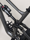 A celebratory image of the Specialized Status 160 after a successful ride on mountain trails.