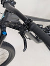 Detail view of the suspension settings on the Specialized Status 160, highlighting its adjustable features.