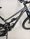 The rear suspension setup on the Specialized Status 160 mountain bike, showcasing its FOX shock performance.