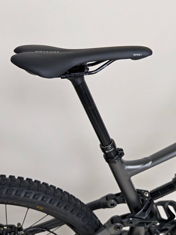 The intricate frame design of the Specialized Status 160, emphasizing its lightweight alloy construction.