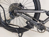 Specialized Stumpjumper EVO Comp Alloy 29/27.5 MULLET / MEDIUM S3 / Very Good Condition - Image portraying the bike in a forest trail setting.