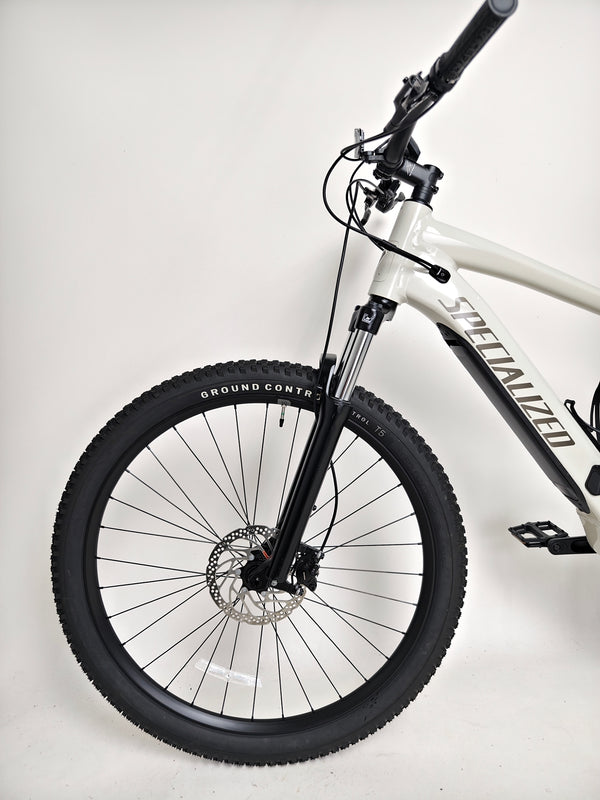 Image capturing the Specialized Turbo Tero 3.0 against a rugged mountain backdrop, enhancing adventure allure.