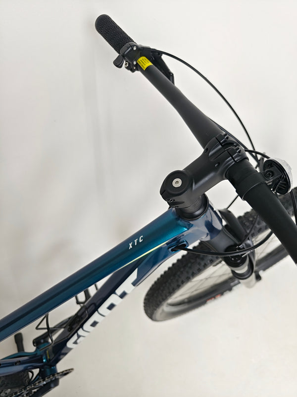 Giant XTC SLR 29 1 Mountain Bike 2024 with Shimano components focused in view.