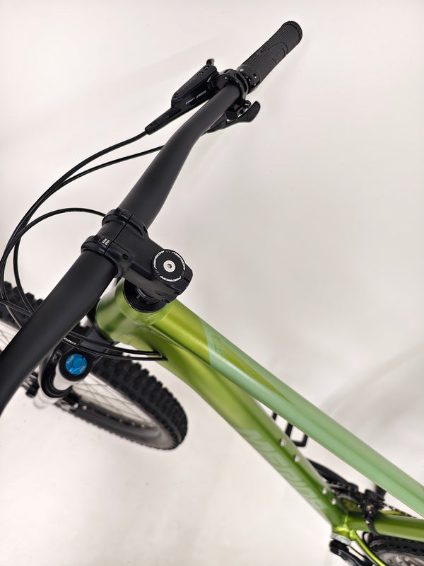 Profile view of Merida Big Trail 700 2024 Mountain Bike - LARGE with striking green color, RRP: £2,000.00 in Excellent Condition.