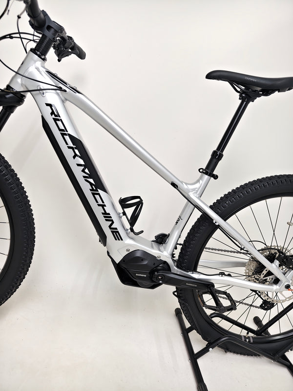 Rock Machine Blizz e60-29 electric mountain bike in like-new condition, showcasing frame and fork details.