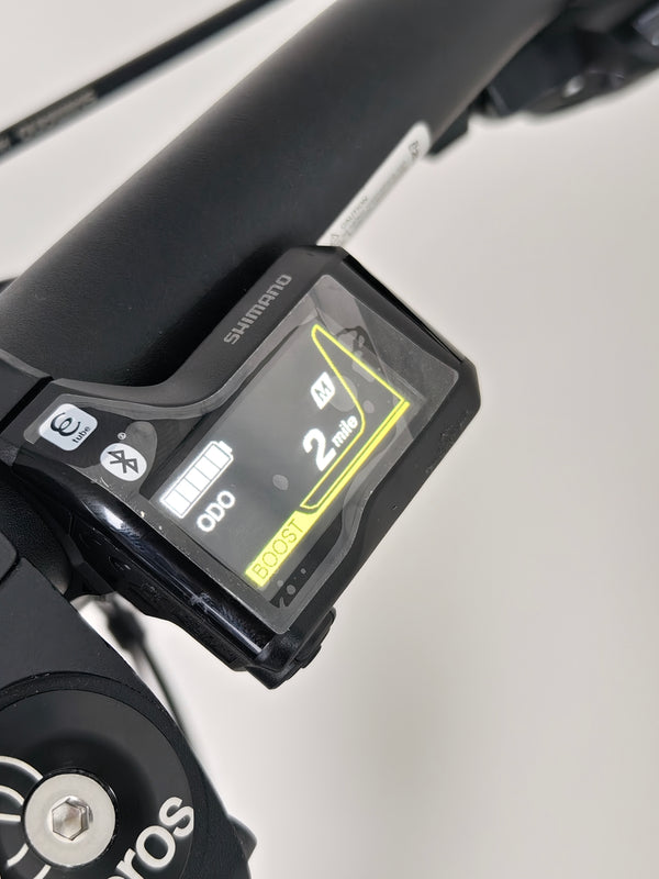 Rock Machine Blizz e60-29 electric mountain bike display showing 2 miles on the odometer, boost mode enabled.