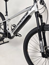 Close-up of Rock Machine Blizz e60-29 electric mountain bike showcasing its frame and suspension features.