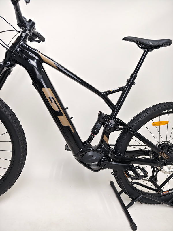 GT E Force Amp+ Full Suspension e-Bike 2024 with a vibrant background, highlighting XL structure and Yari model, in excellent condition, just 51 miles, £2,250.