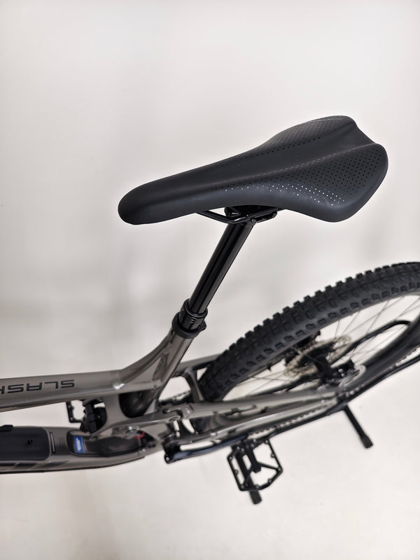 Dynamic shot of Trek Slash 7 Gen 5, X-LARGE, showcasing Lyrik suspension and SLX gear, RRP: £2,775.00, special offer at £1,760.00 with free rapid delivery included.