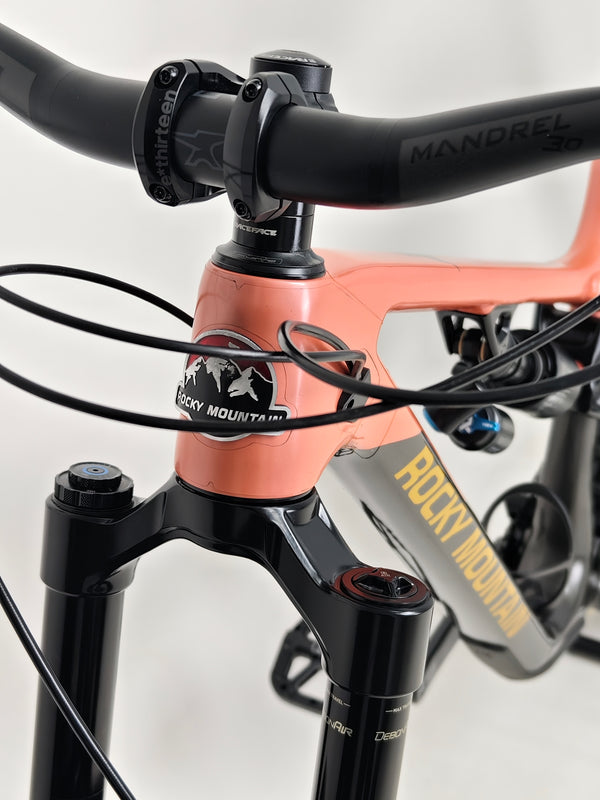 The Rocky Mountain Altitude Carbon 70 2022 mountain bike displayed in a contrasting environment, perfect for riders at £2,590.00 with free UK delivery.