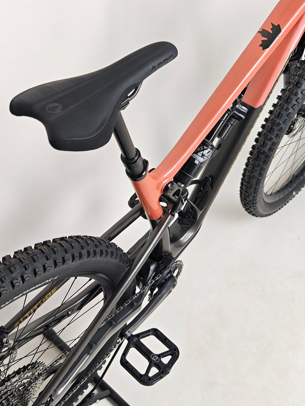 Vibrant image of the Rocky Mountain Altitude Carbon 70 2022 mountain bike captured on a trail, ready for sale at £2,590.00 with free UK delivery.