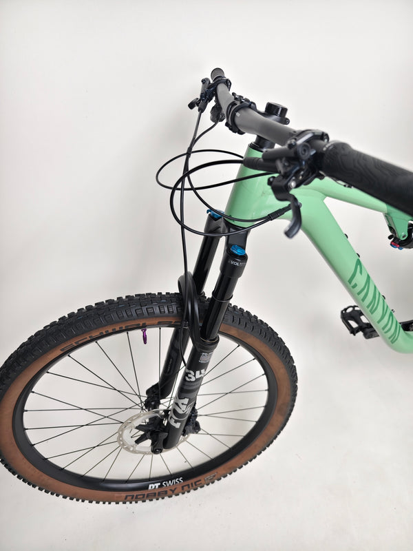 2023 Canyon Neuron 7 Full Suspension Bike stored upright, featuring a clean frame in Large size, in Very Good Condition.
