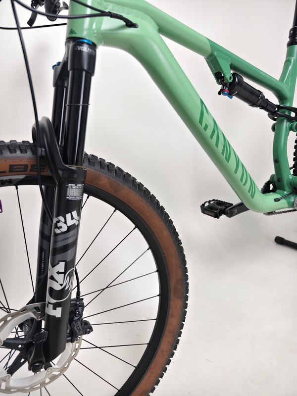 Overall shot of the 2023 Canyon Neuron 7 Full Suspension Bike in Large size parked in a scenic area, in Very Good Condition.