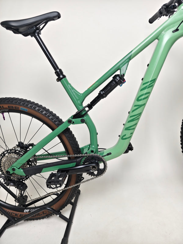 Close-up of the wheels on the 2023 Canyon Neuron 7 Full Suspension Bike, Large size, exhibiting DT Swiss M1900 Spline, in Very Good Condition.