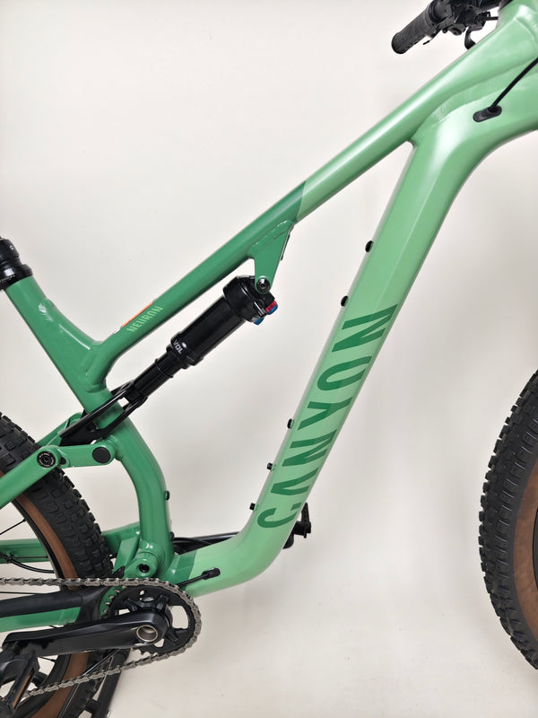 Focused image of the Canyon Neuron 7 Full Suspension Bike's technical components, including shifters, Large size, in Very Good Condition.