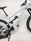 Action shot of the Specialized Status 160 2023 Large S4 in a natural setting, highlighting its aggressive trail riding capabilities, available for £1,750 (RRP £2,900) in excellent used condition.