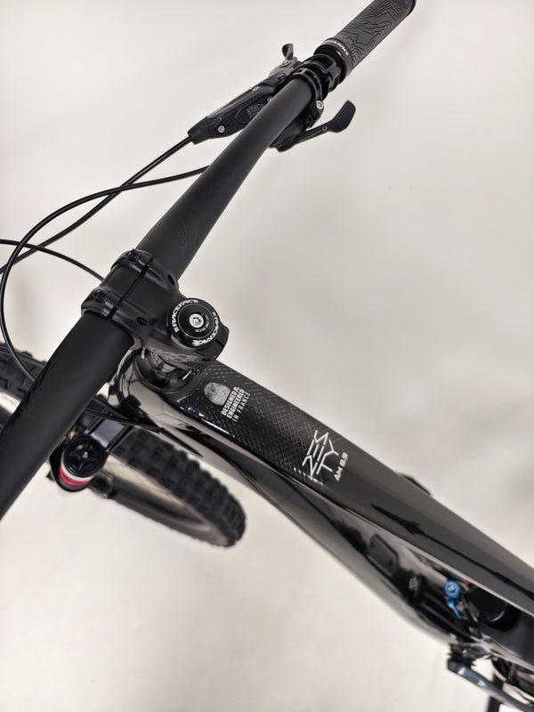 Inspecting the braking system on the 2023 Lapierre Zesty AM CF 8.9 Large available for sale at £2,850.