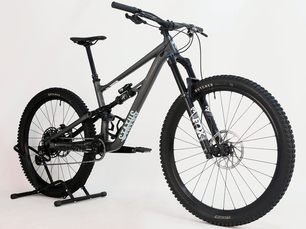 Front angle of the Specialized Status 160 mountain bike, displaying its aggressive geometry for better handling.