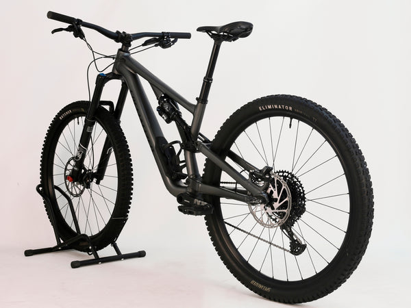 Close-up of Specialized Stumpjumper EVO Comp Alloy 29 Medium S3 tire tread and wheel design.