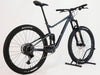 Side view of Giant Stance 29 2 2024/LARGE mountain bike, showcasing its full suspension system and sturdy alloy frame.