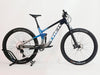 Rear view of the Trek Top Fuel 9.7 2022 CARBON mountain bike highlighting the wheel and shock configuration.