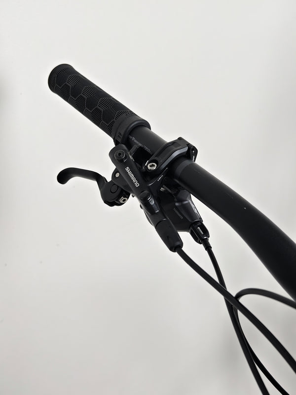 Trek Top Fuel 8 2024 Large Frame Full Suspension Bike at eMado - Picture highlighting the bike's light and durable frame.