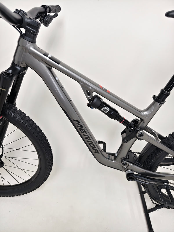 Rear angle of the Merida One-Sixty 500 29 2023 mountain bike highlighting its drivetrain and rear wheel.