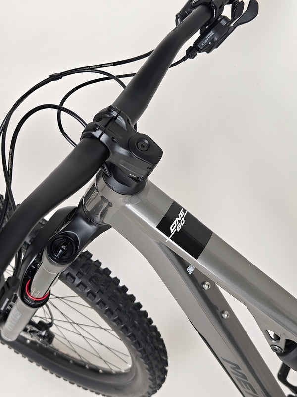 Detailed view of the rear triangle and shock absorber on the Merida One-Sixty 500 29 2023 mountain bike.