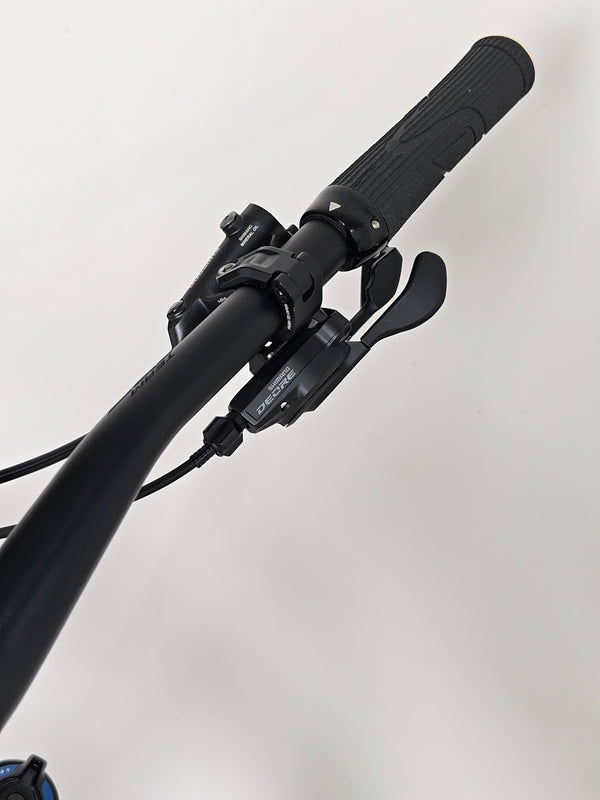 Rear angle view of the Merida One-Sixty 500 29 2023 mountain bike, showcasing its geometry and design.