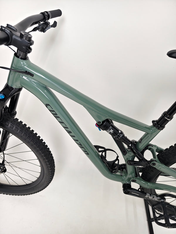 Detail of the FOX suspension components on the used Specialized Stumpjumper Comp Alloy mountain bike.