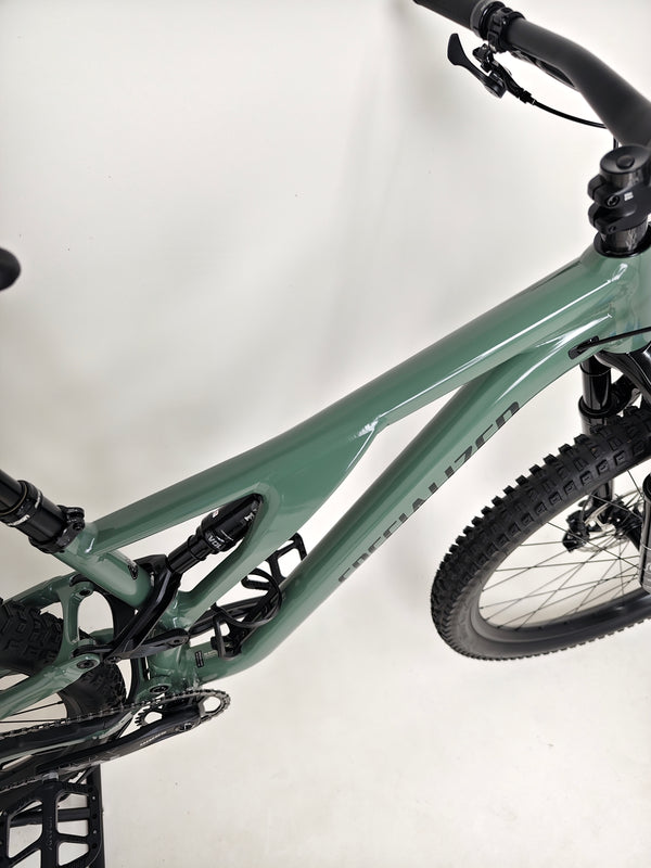 Image of the used Specialized Stumpjumper Comp Alloy captured on a scenic trail.