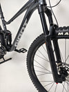 Exterior shot of the Giant Stance 29 2 mountain bike in ideal lighting, showcasing its design.