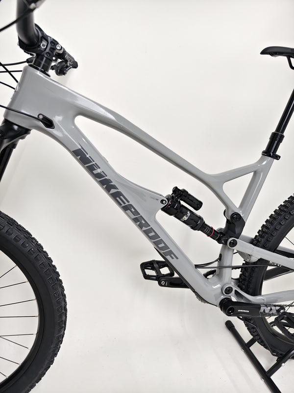 Nukeproof Mega 290 CARBON - Close-up of the Maxxis Aggressor tire tread design.