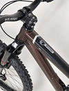 High-quality view of the Orange ALPINE 6 mountain bike's frame and suspension system.