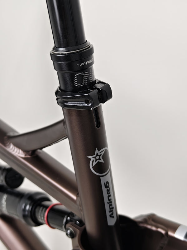 Top angle view of the Orange ALPINE 6 mountain bike, ready for a thrilling ride.