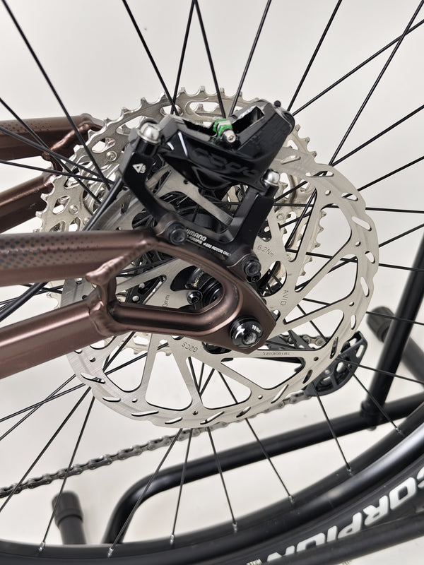 A close-up of the frame geometry on the Orange ALPINE 6 mountain bike.