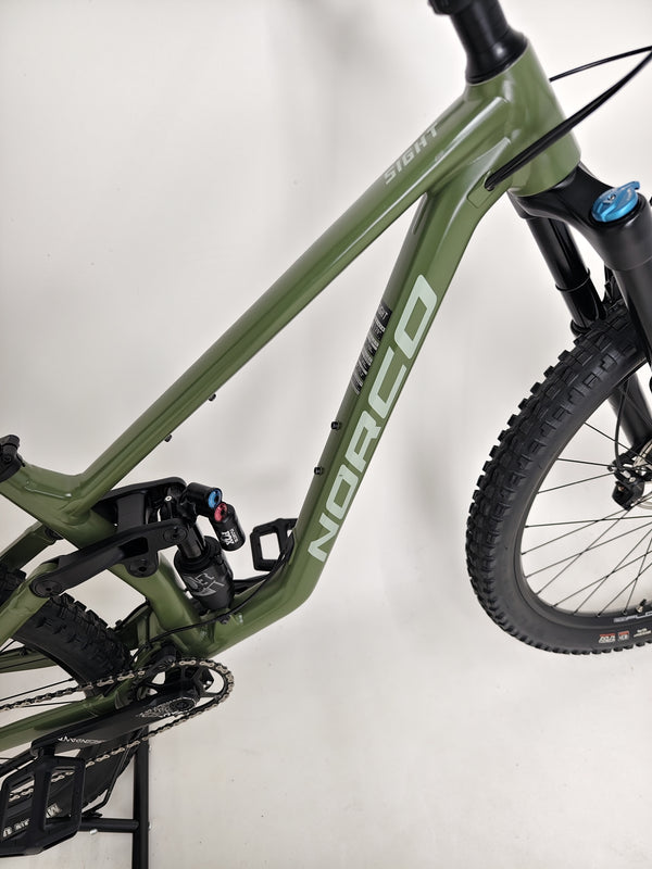 Rider experiencing the thrill on a Norco Sight A2 2021 mountain bike riding uphill.