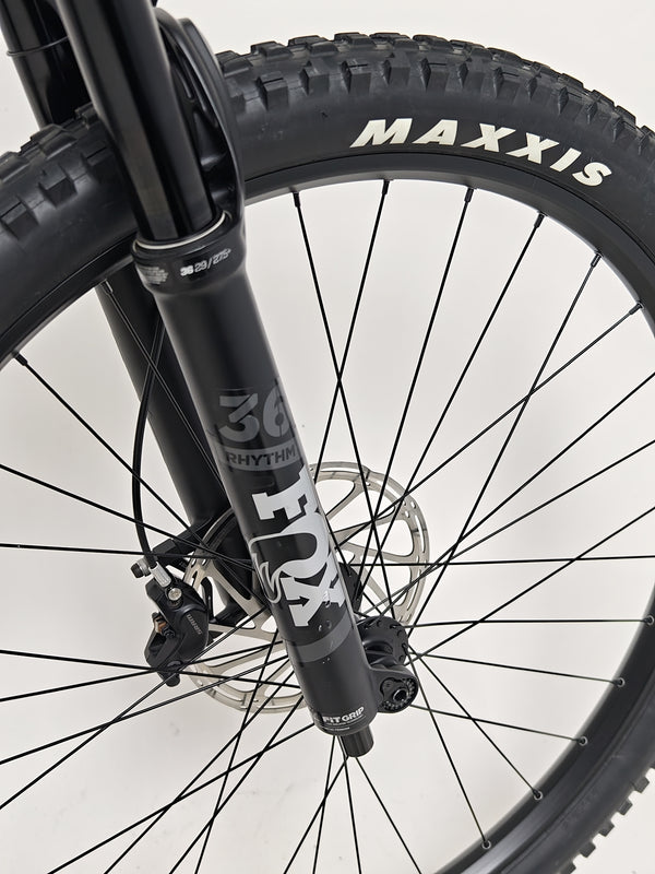 Performance view of the Norco Sight A2 2021 mountain bike in action on a technical trail.