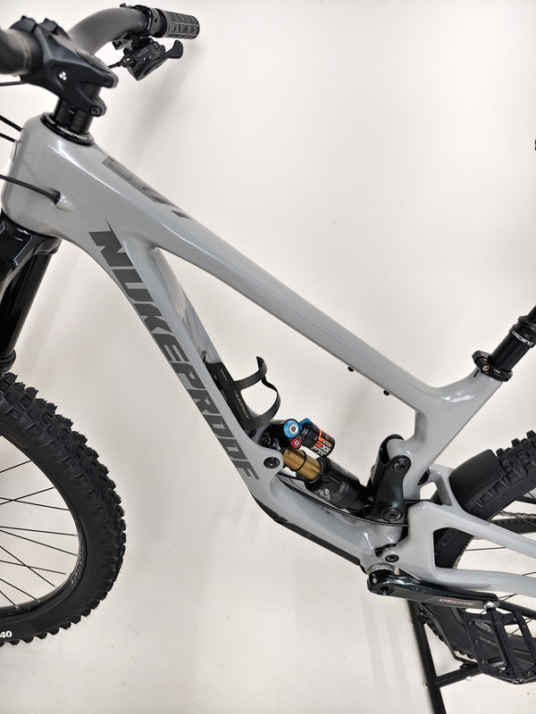 Nukeproof Giga 290 Comp Carbon 2022 bike captured mid-ride by an athlete.