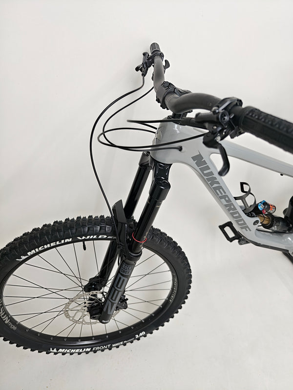 Nukeproof Giga 290 Comp Carbon 2022 bike angled for dramatic effect.