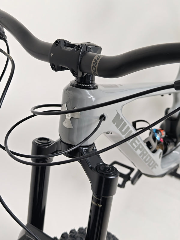 Wide view of Nukeproof Giga 290 Comp Carbon 2022 showcasing the full bike.