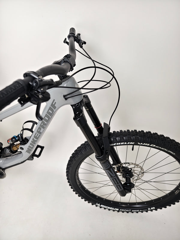 Nukeproof Giga 290 Comp Carbon 2022 angled shot highlighting its suspension.