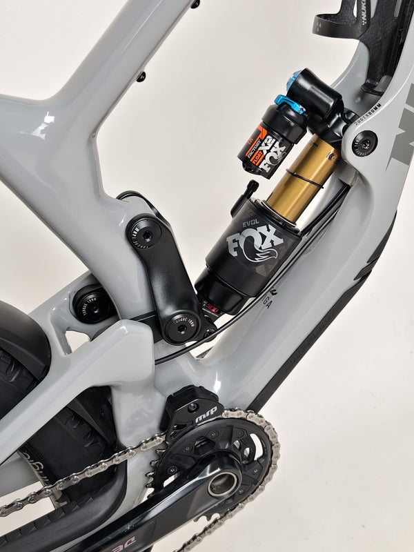 Nukeproof Giga 290 Comp Carbon 2022 bike navigating through forest trails.