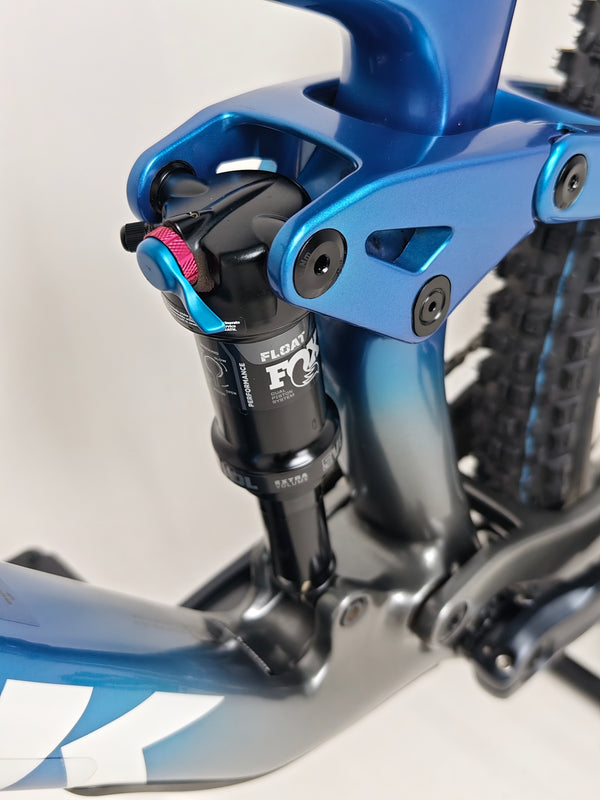The underside view of the Trek Top Fuel 9.7 2022 CARBON bike capturing its stability and design.